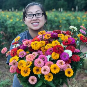 Der Holcomb with flowers harvested from her family farm